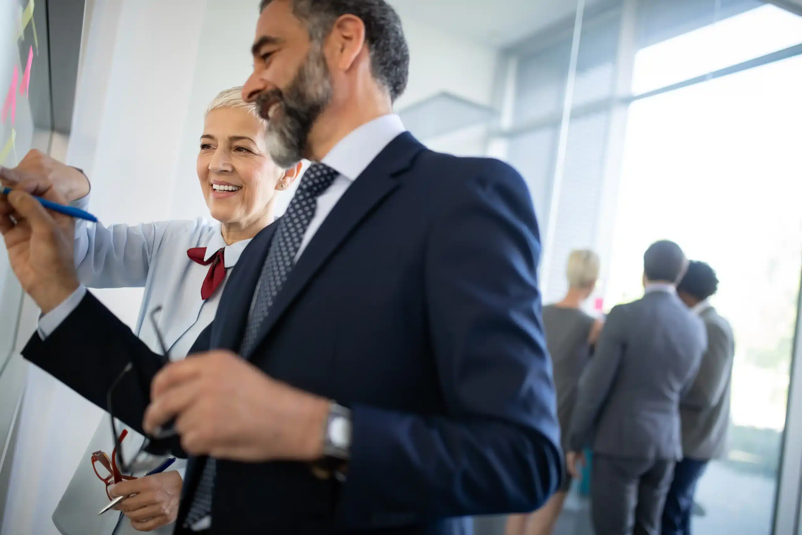 The image shows two partners working together in a business environment. The image illustrates the text about partnership agreement.